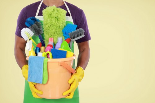 Cleaner working in a modern Knightsbridge apartment kitchen